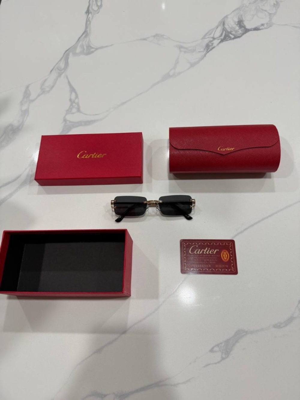 Cartier Rimless Sunglasses with Black Lenses and Gold Hardware